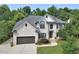 Beautiful two-story brick home featuring an attached two-car garage and a well-maintained front lawn at 4219 Peachway Dr, Durham, NC 27705