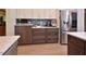 Kitchen with stainless steel appliances, modern cabinetry, and hardwood floors; an ideal space for cooking at 4219 Peachway Dr, Durham, NC 27705