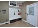 Functional mudroom with bench seating, storage, and access to the exterior at 4219 Peachway Dr, Durham, NC 27705