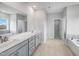 Spacious Primary bathroom featuring double sinks, a large vanity, and a soaking tub at 43 Fountainhead Ln, Garner, NC 27529