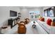 Cozy bonus room with entertainment center, comfortable seating, and a view of the neighborhood at 43 Fountainhead Ln, Garner, NC 27529