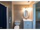 Tiled bathroom with shower/tub, toilet, and vanity at 438 N Hickory St, Angier, NC 27501