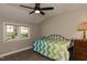 Cozy bedroom with hardwood floors, ceiling fan, and window view at 438 N Hickory St, Angier, NC 27501