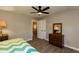 Bedroom boasts hardwood floors, neutral walls, and modern ceiling fan at 438 N Hickory St, Angier, NC 27501