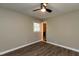 Bedroom showcasing hardwood floors, ceiling fan, and an en-suite bathroom at 438 N Hickory St, Angier, NC 27501