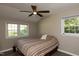 Bedroom featuring ceiling fan, hardwood floors, natural light, and modern style at 438 N Hickory St, Angier, NC 27501