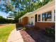 Charming brick home featuring manicured landscaping and a welcoming entrance at 438 N Hickory St, Angier, NC 27501