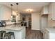 Modern kitchen with granite countertops, stainless steel appliances, and ample cabinet space at 438 N Hickory St, Angier, NC 27501