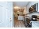 Bright, modern kitchen with stainless steel appliances and granite countertops at 438 N Hickory St, Angier, NC 27501