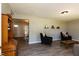 Spacious living room showcases wood floors and views of the dining room at 438 N Hickory St, Angier, NC 27501