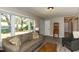 Bright living room features large windows and stylish, neutral decor at 438 N Hickory St, Angier, NC 27501