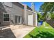 Backyard featuring a patio, siding, door, and a grassy area at 4649 Pine Trace Dr, Raleigh, NC 27613
