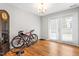 Versatile bonus room with French doors and hardwood floors, perfect for recreation at 4649 Pine Trace Dr, Raleigh, NC 27613