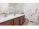 Well-lit bathroom with a vanity, sink, a white countertop, and a shower with white curtain at 4963 Highcroft Dr, Cary, NC 27519