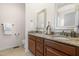 Modern bathroom features granite counters, double sinks, and dark wood cabinets at 4963 Highcroft Dr, Cary, NC 27519