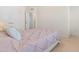 Bright bedroom with neutral carpet, large closet, and a comfortable bed with a pink comforter at 4963 Highcroft Dr, Cary, NC 27519