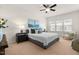 Relaxing main bedroom features a ceiling fan, bedside tables, and natural light at 4963 Highcroft Dr, Cary, NC 27519