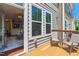 Deck with seating looking inside with windows to the side at 4963 Highcroft Dr, Cary, NC 27519