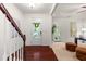 Elegant foyer featuring hardwood floors, staircase, and a view into the spacious living area at 4963 Highcroft Dr, Cary, NC 27519