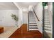 Inviting foyer with hardwood floors, staircase, and natural light, offering a warm welcome at 4963 Highcroft Dr, Cary, NC 27519