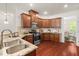 Kitchen with stainless steel appliances, granite countertops, tile backsplash, and hardwood floors at 4963 Highcroft Dr, Cary, NC 27519
