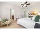 Comfortable main bedroom features a ceiling fan, bedside tables, and natural light at 4963 Highcroft Dr, Cary, NC 27519