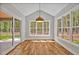 Bright breakfast nook with vaulted ceilings, hardwood floors, and views of the backyard at 503 Damascus Church Rd, Chapel Hill, NC 27516