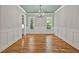 Elegant dining room with hardwood floors, wainscoting, and a decorative ceiling at 503 Damascus Church Rd, Chapel Hill, NC 27516