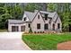 Beautiful home featuring an attached garage, manicured lawn, and brick accents at 503 Damascus Church Rd, Chapel Hill, NC 27516