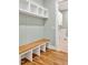 Bright mudroom boasts custom built-in shelving, bench, and hardwood floors that add warmth and style at 503 Damascus Church Rd, Chapel Hill, NC 27516