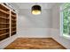 Bright office space featuring hardwood floors, wainscoting, built-in shelving, and ample light at 503 Damascus Church Rd, Chapel Hill, NC 27516