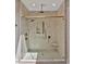 Luxurious shower with glass door, rain shower head, handheld wand, seat and herringbone tile at 503 Damascus Church Rd, Chapel Hill, NC 27516