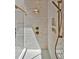 Modern shower with glass door, rain shower head, handheld wand and decorative herringbone tile at 503 Damascus Church Rd, Chapel Hill, NC 27516