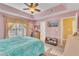Bedroom with ceiling fan and large window letting in natural light at 513 Woodson Dr, Clayton, NC 27527