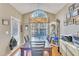 Elegant dining room boasts a vaulted ceiling, large window, chandelier, and hardwood flooring at 513 Woodson Dr, Clayton, NC 27527