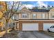 Charming townhouse with a brick facade and attached two-car garage in a well-maintained neighborhood at 513 Woodson Dr, Clayton, NC 27527