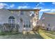This home's rear exterior features siding, windows, and well-manicured lawn at 513 Woodson Dr, Clayton, NC 27527