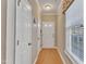 Bright foyer features hardwood floors, a white door, and a window with blinds for natural light at 513 Woodson Dr, Clayton, NC 27527