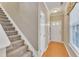 Inviting foyer and staircase with natural light, leading to the upper level of the home at 513 Woodson Dr, Clayton, NC 27527