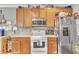 Traditional style kitchen featuring stainless steel appliances and wooden cabinets at 513 Woodson Dr, Clayton, NC 27527