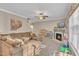 Comfortable living area featuring a large sectional sofa, fireplace, and view of the backyard at 513 Woodson Dr, Clayton, NC 27527
