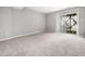 Neutral bedroom featuring carpet and a sliding glass door to the outside at 5505 Crabtree Park Ct, Raleigh, NC 27612
