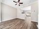 Bright open-concept space featuring hardwood flooring, leading to a modern kitchen at 5505 Crabtree Park Ct, Raleigh, NC 27612