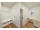 Mudroom features built-in bench and storage with hooks, along with a convenient built-in office space with a desk at 5545 Silk Hope Gum Springs Rd, Siler City, NC 27344