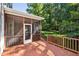 Relaxing screened-in porch with wooden floors overlooking a private backyard at 5940 Dahlberg Dr, Raleigh, NC 27603