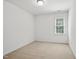 Simple bedroom featuring a single window and neutral carpeting at 5940 Dahlberg Dr, Raleigh, NC 27603