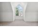 Large bonus room with dormered ceiling window and neutral carpet at 5940 Dahlberg Dr, Raleigh, NC 27603