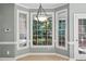Bright breakfast nook with bay window and chandelier lighting at 5940 Dahlberg Dr, Raleigh, NC 27603