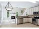 Open-concept kitchen featuring stainless appliances, granite countertops, and views of the living area at 5940 Dahlberg Dr, Raleigh, NC 27603