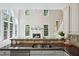 Modern kitchen with granite counters, stainless steel appliances, and fireplace views at 5940 Dahlberg Dr, Raleigh, NC 27603